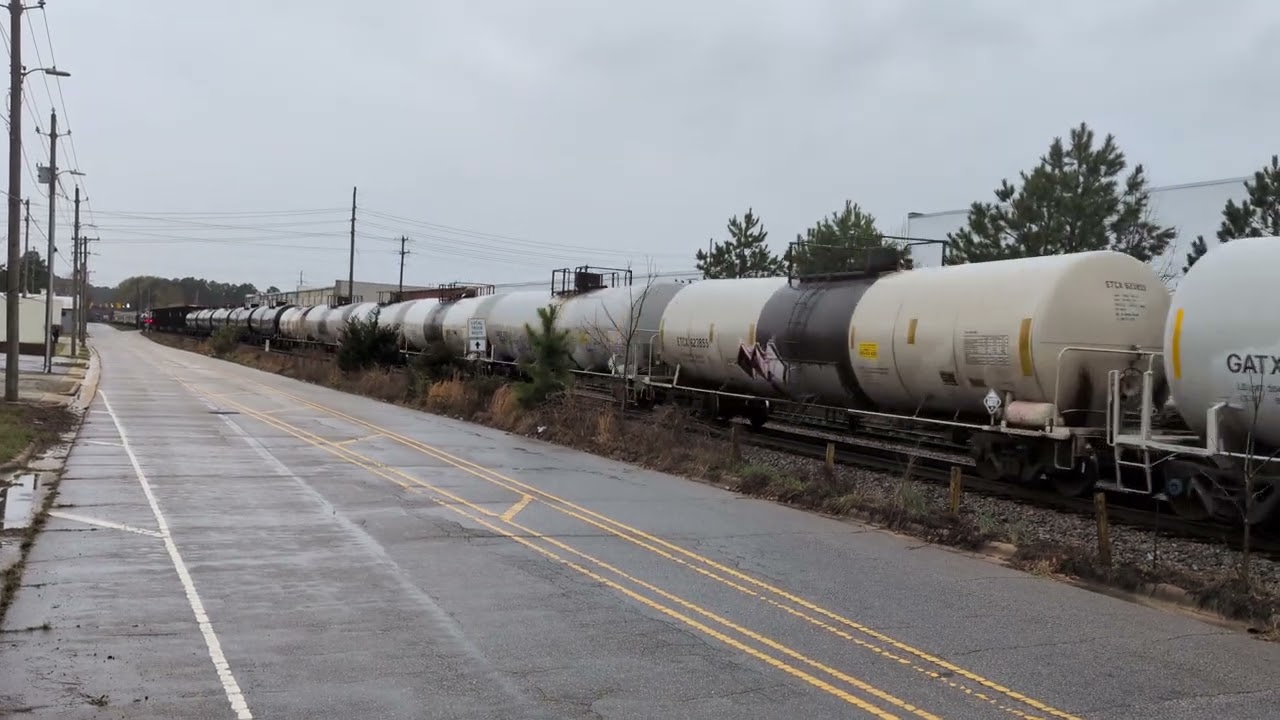 CSX 7035 leads a long south bound mixed freight with CSX 7560 as a mid DPU Sunday 3/15/2026