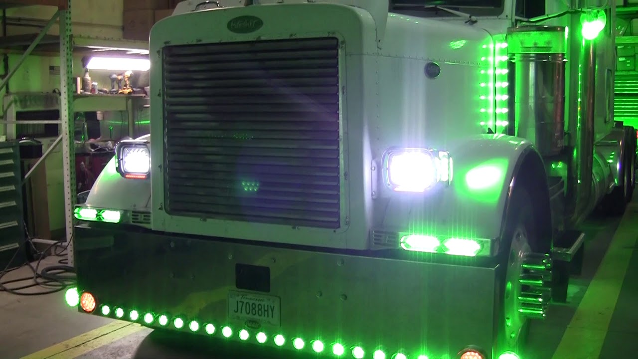 Peterbilt with Green Dual Revolution LED Lights - Empire Chrome Shop