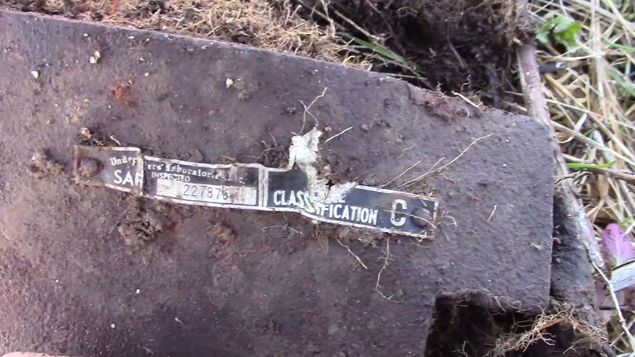 The remains of an old Nash Motors car and a safe