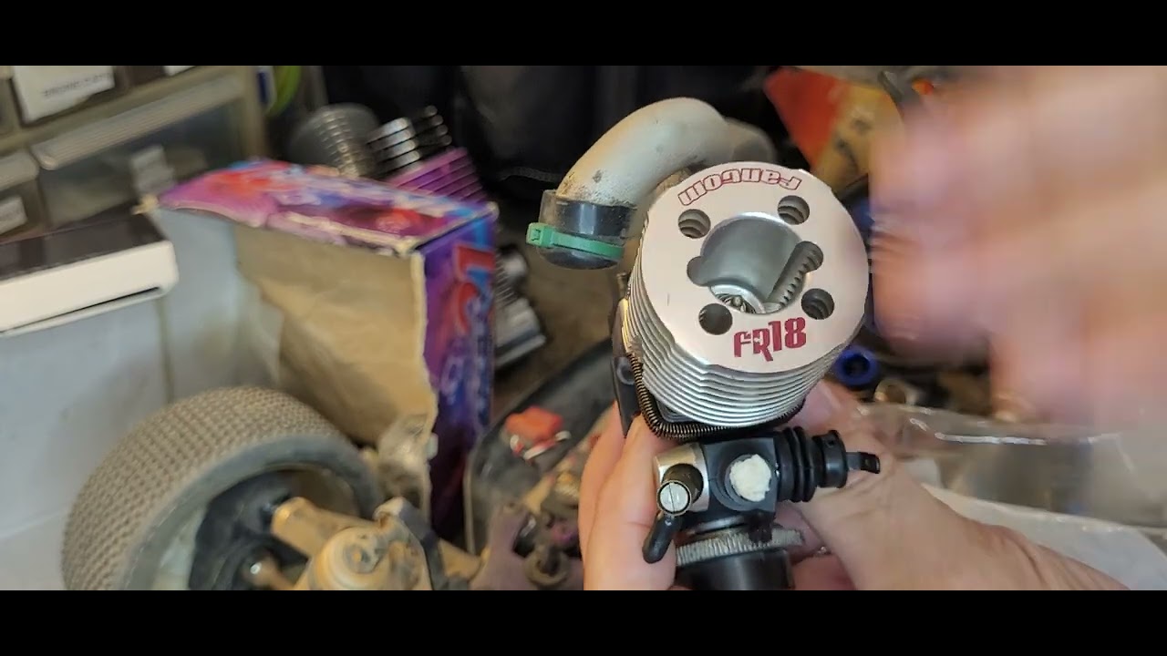 Nitro engine cooling head orientation cutouts for exhaust bolt access and glow plug flow path