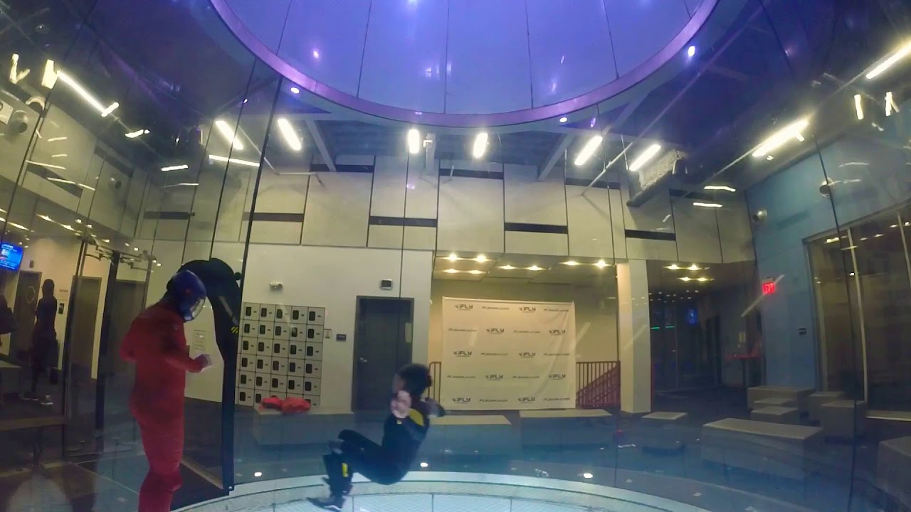 Indoor skydiving belly carving, front layouts and sit flying