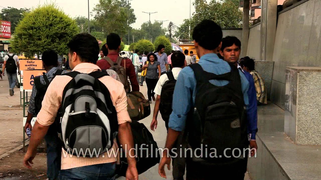 People come and go at the Saket Metro Station