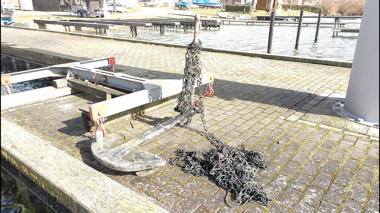 Salvaging an old anchor, Pl&ouml;n Lake. Germany - march 2021