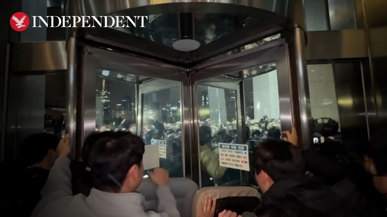 South Korean forces clash with crowds outside parliament after martial law declared