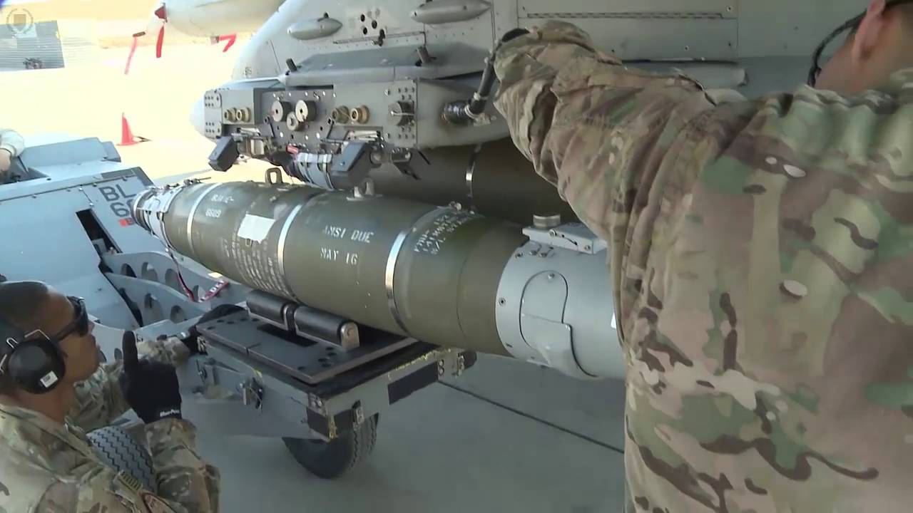 U.S. Air Force Airmen Load and Maintain Munitions on F-16 Aircraft