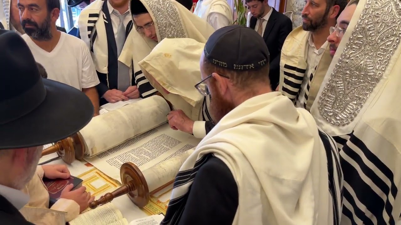 Rabbi reading the Torah