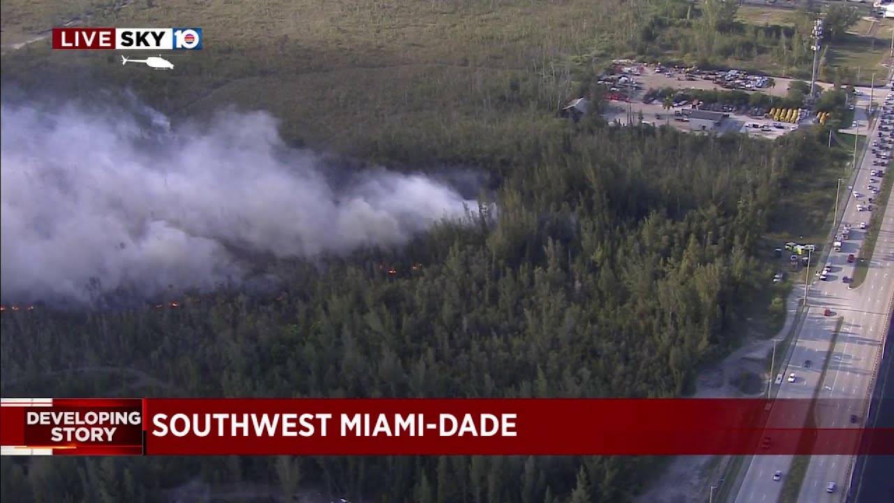 Crews rush to battle large grass fire in southwest Miami-Dade