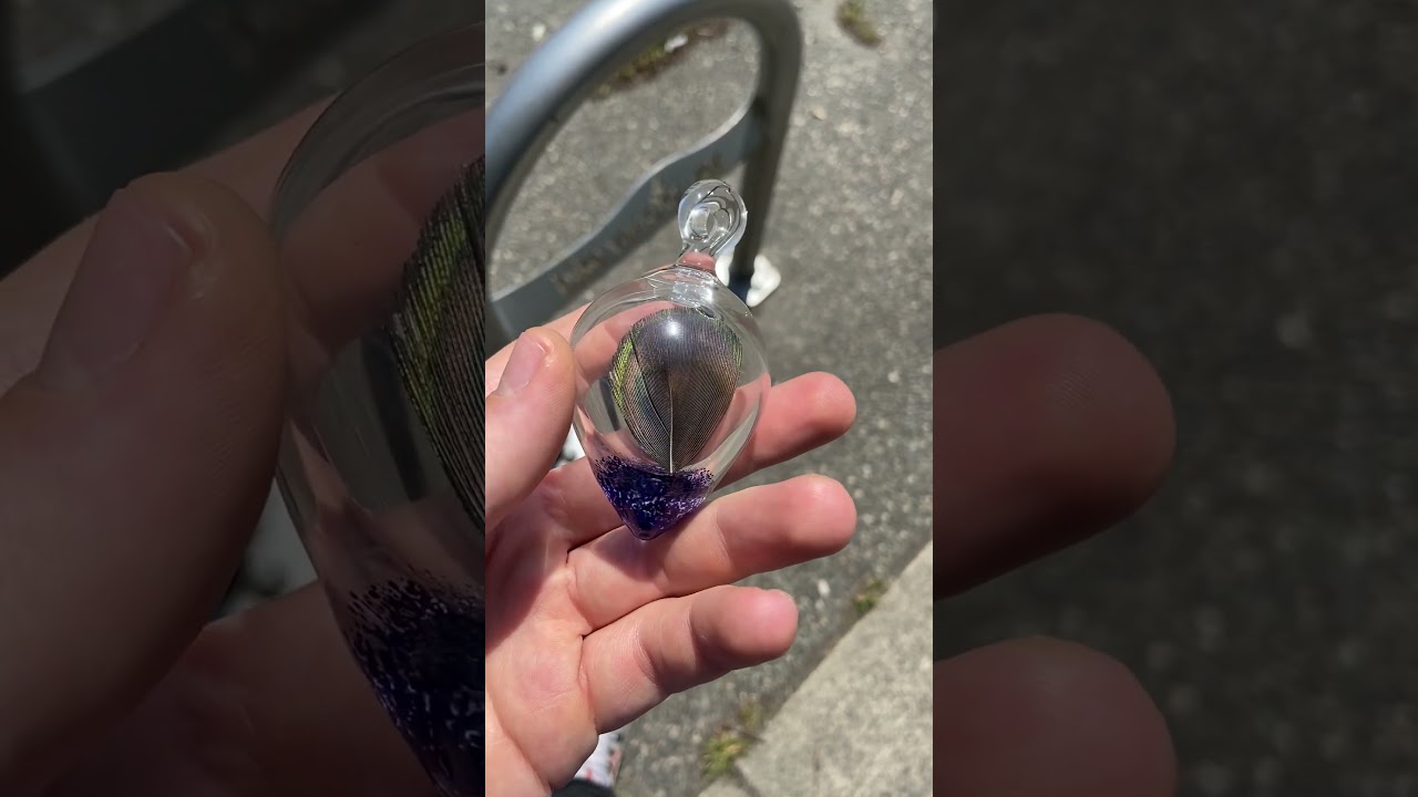 Peacock feather pendant made by Leash Glass