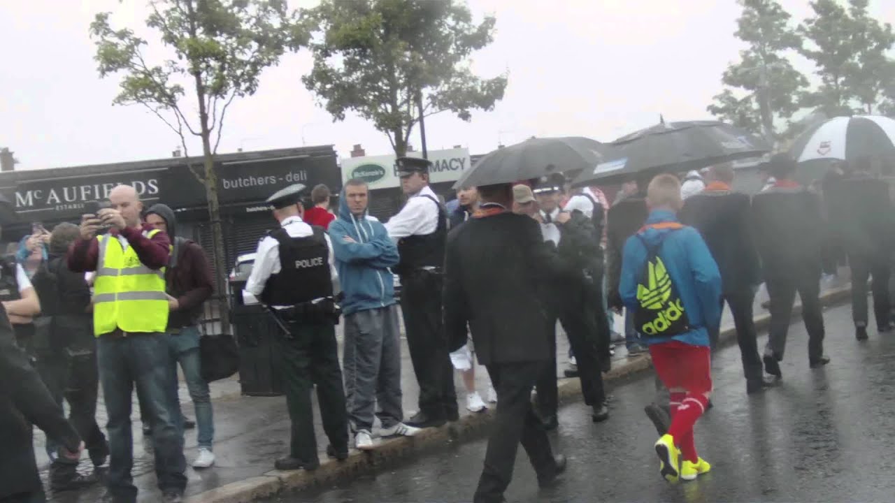The Orange Order The 12th 2014 feeder parade passing the Ardoyne shop fronts