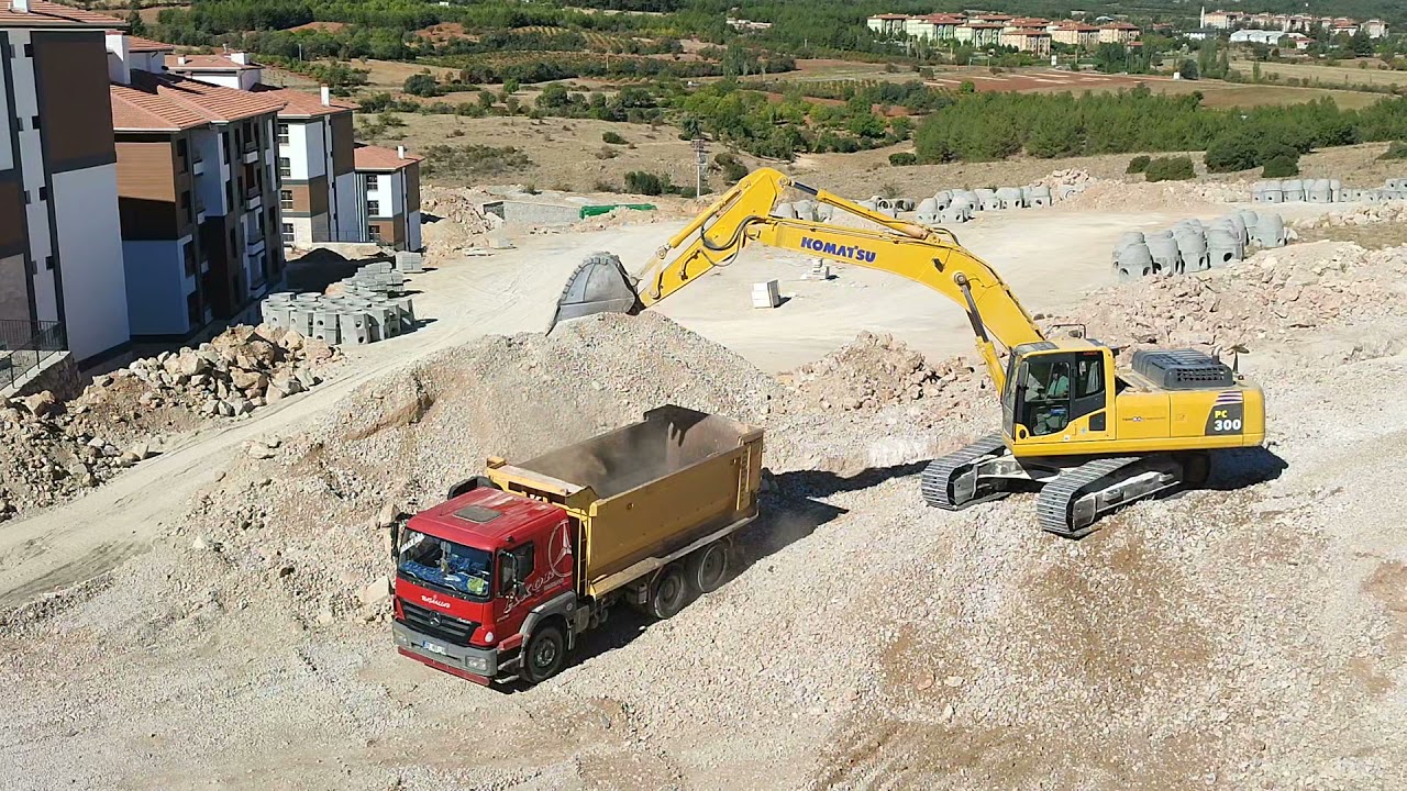 Komatsu PC300-8 Excavator Loading Trucks