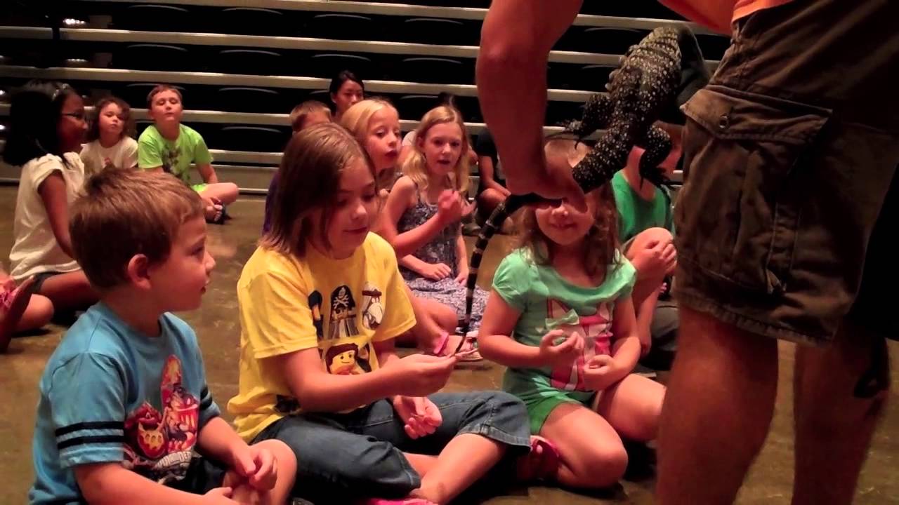 Briz loses her first tooth, then pets a bunch of reptiles!