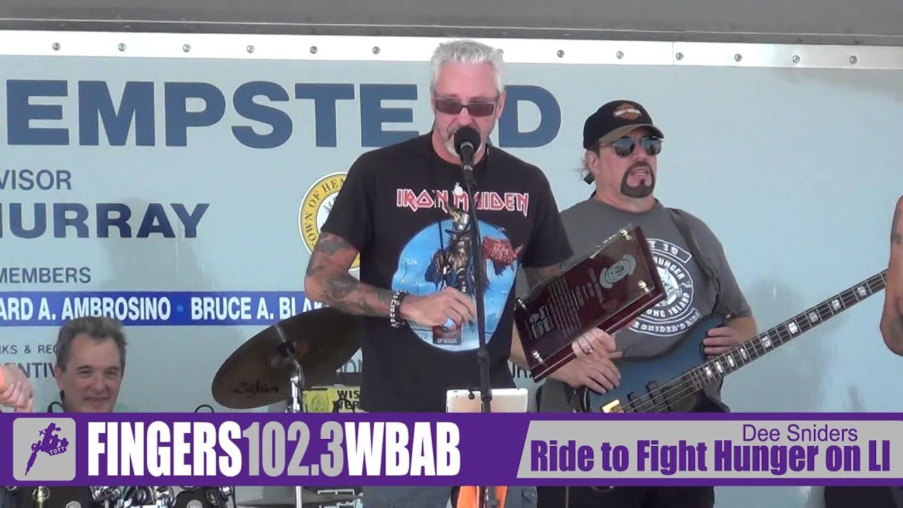 Fingers from 102.3 WBAB receiving an award from Dee Snider of Twisted Sister