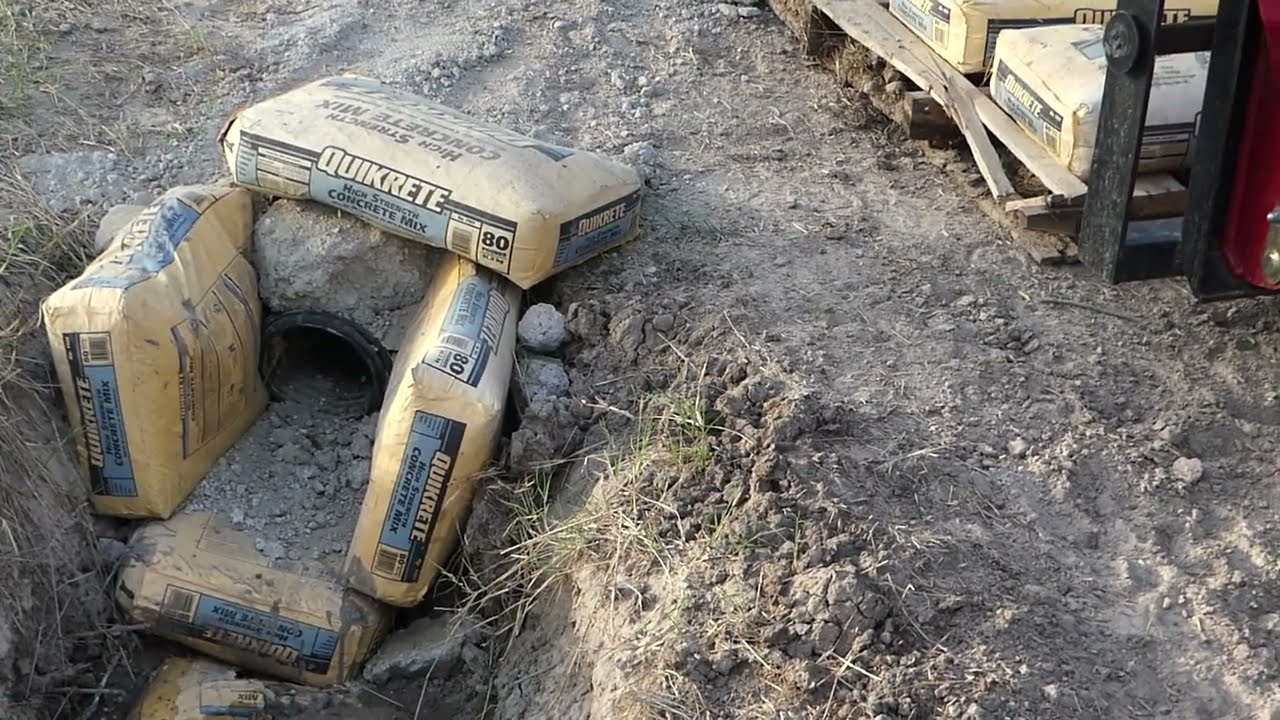 Cement bags are ruined. How to use old, cured, concrete bags into a very good culvert end guard