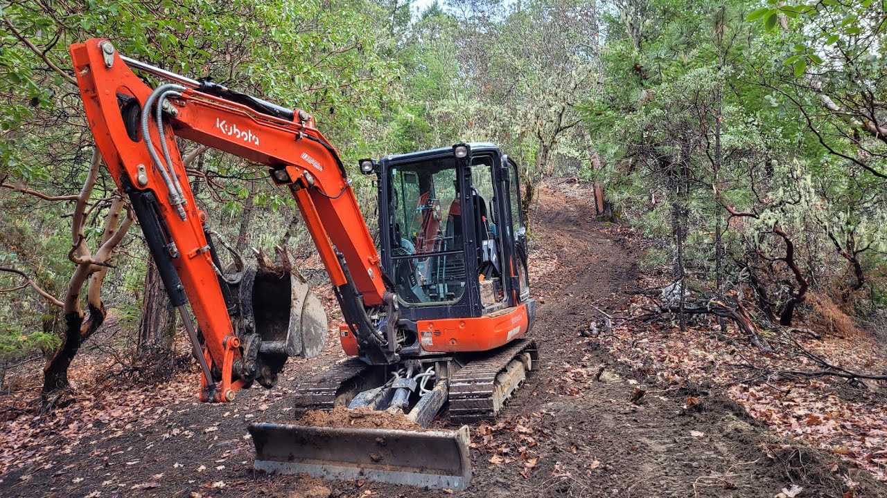 Mud bogging on a new downhill ATV road with the Kubota KX 040 4