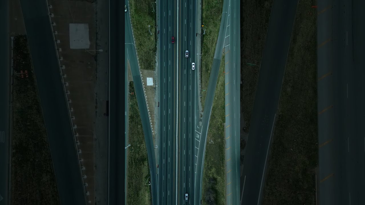 Highway with cars in an overhead aerial view.