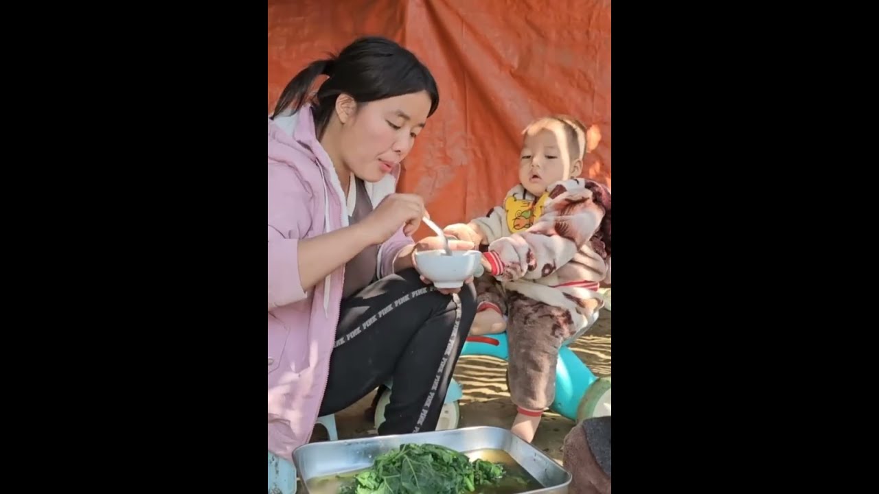 A Mother Busy Caring for Her Children