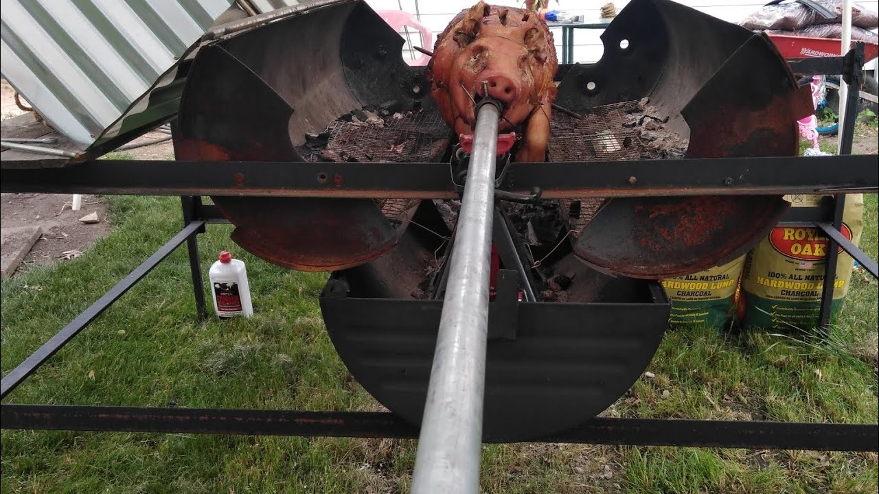 Homemade grill to rotisserie a whole pig lechon asao a la varita