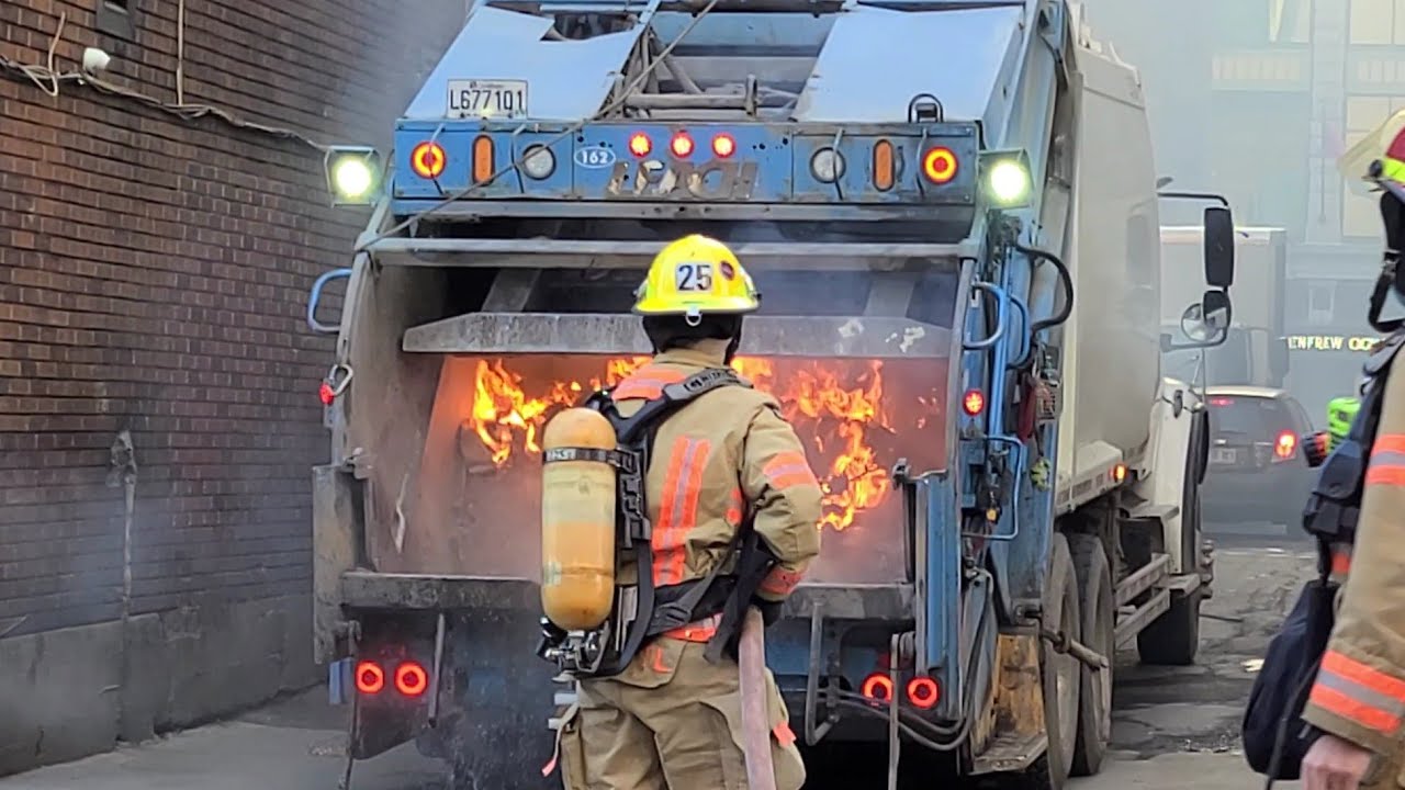 🔥 Garbage truck catches fire in the downtown core of Montreal during lunch hour! 🚚
