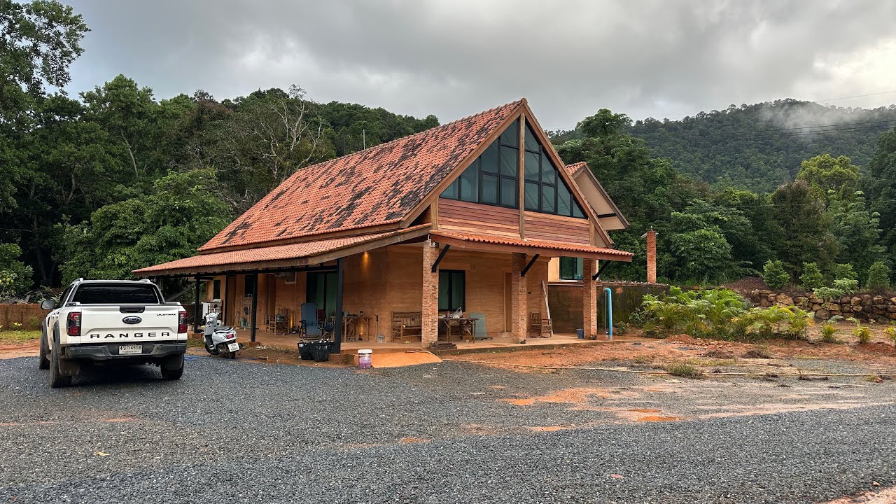 Living in a fishing village in Thailand and finishing our rammed earth house.. 
