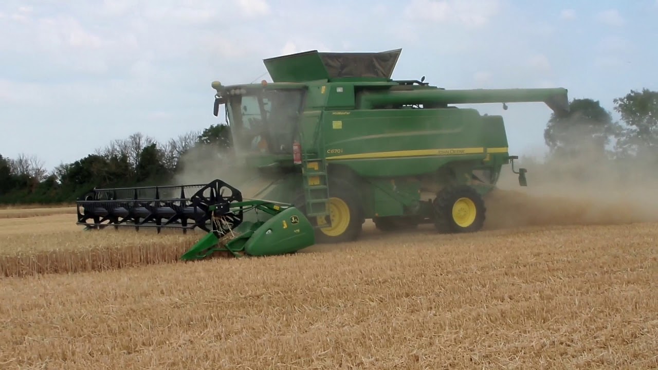 John Deere C670i Cutting Wheat