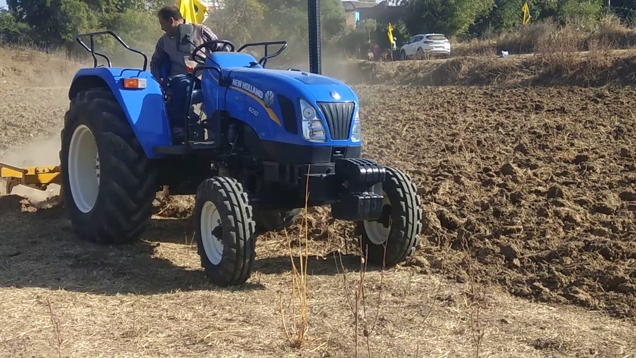 New Holland Tractor 6010 with Chisel Plough