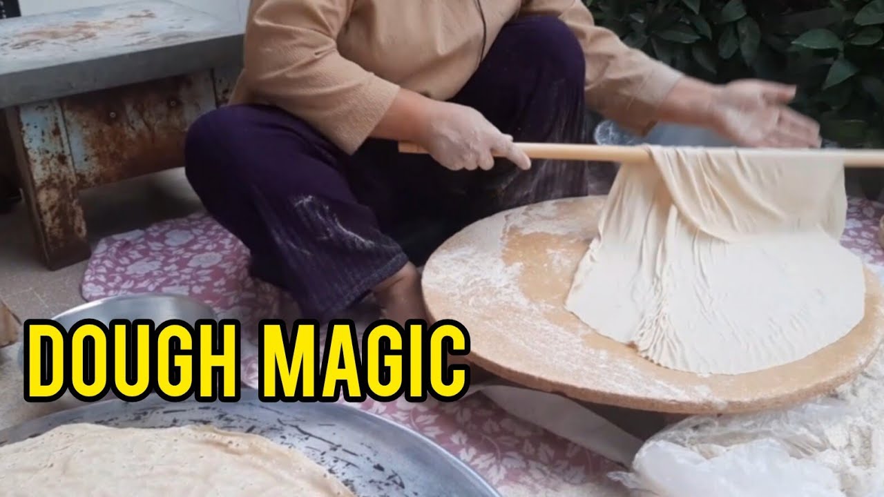 “How Iranians Bake Paper-Thin Bread on a Hot Saj”