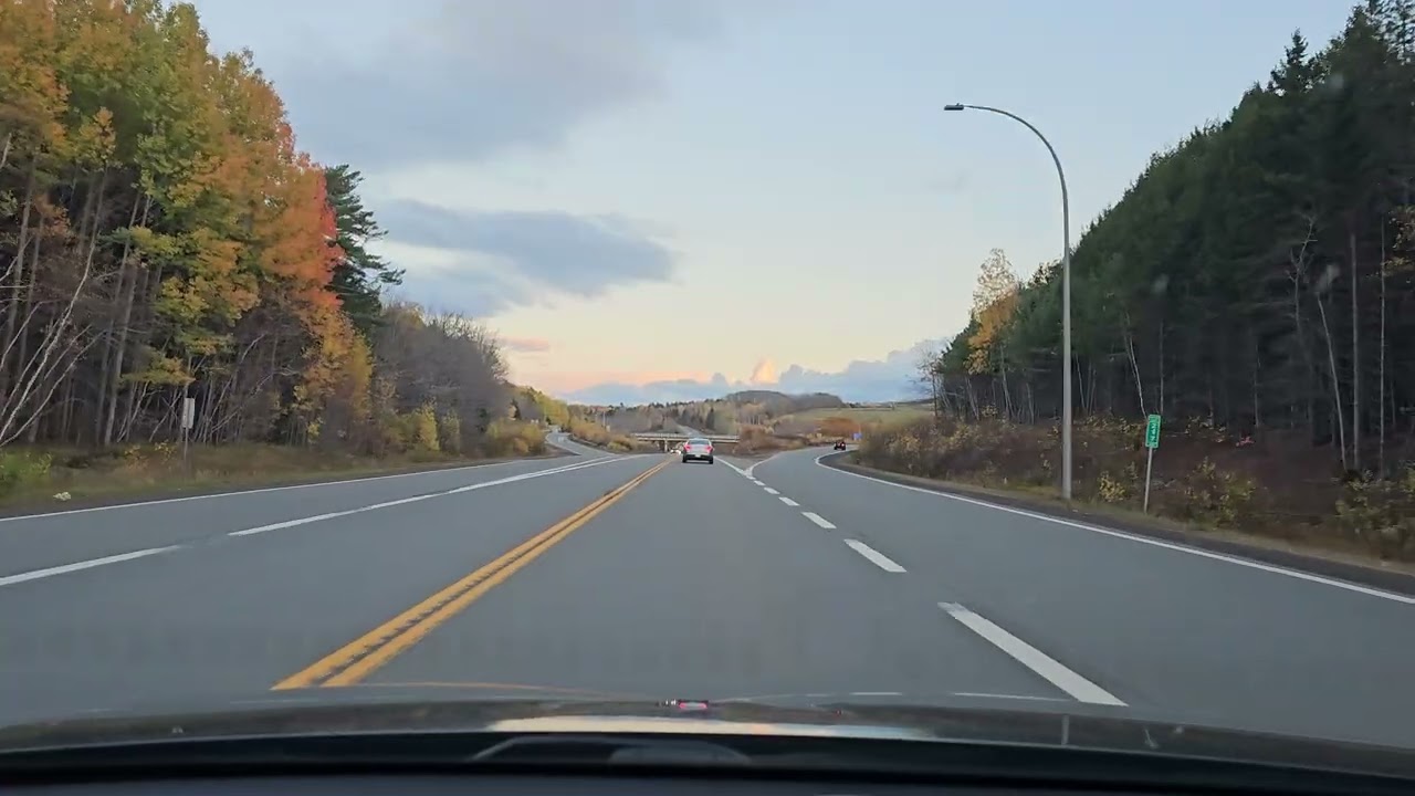 Pretty colourful autumn drive at dusk on Highway 1 and 101 towards New Minas, Nova Scotia, Canada. 