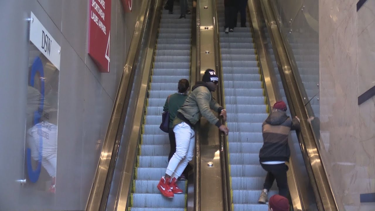 Touching Strangers Hands on Escalator in New York City