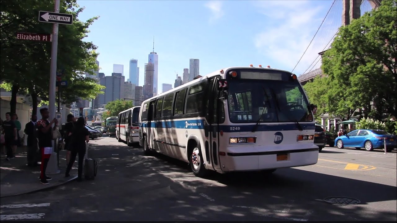 A Parade Of Vintage Buses and MTA Trucks Leaving Bus Festival At Brooklyn Bridge Park