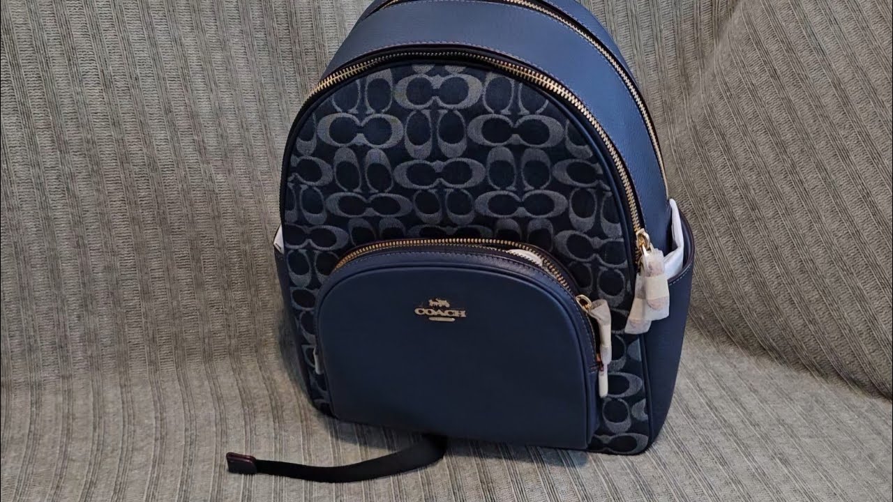 Popping the tag on my denim Coach court backpack!