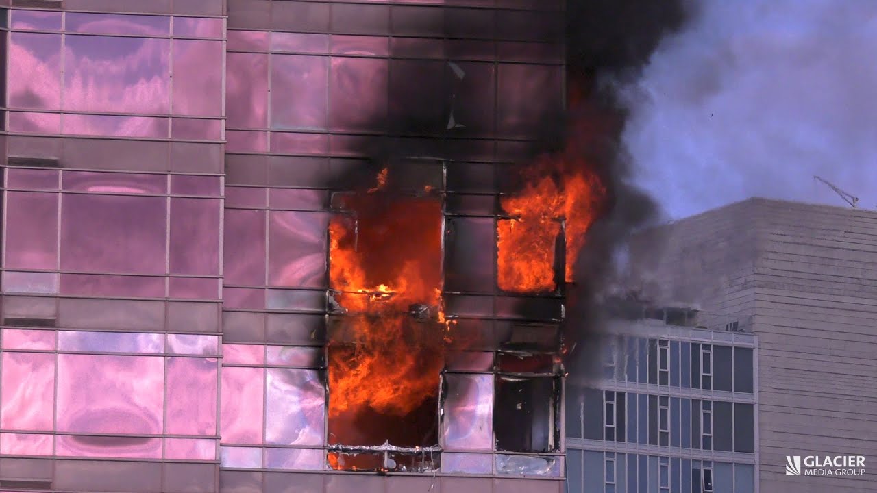 Flames erupt out of Vancouver residential high-rise building