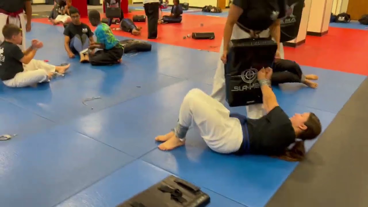 Everson's Karate Institute teens learning how to escape from being duck taped.