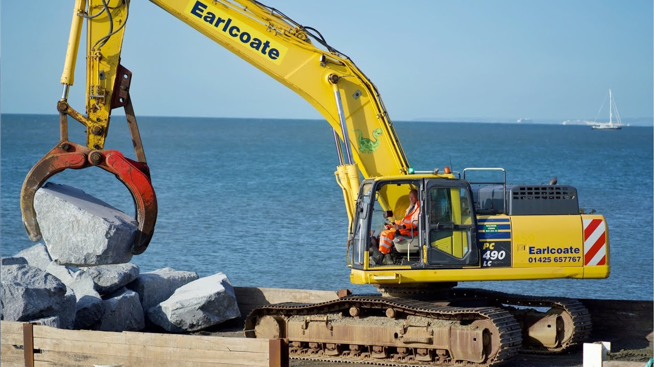 Komatsu PC490 Unloading Rock Armour from Barge