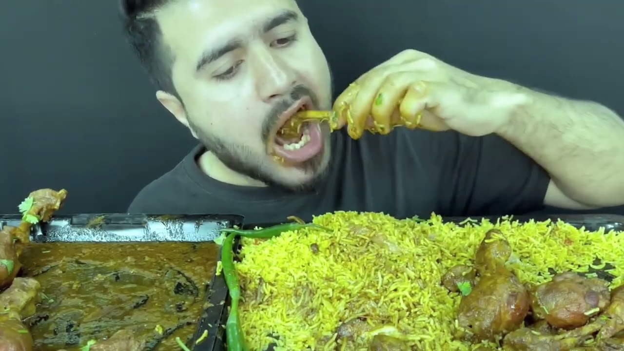 Eating mutton curry chicken legs with rice 