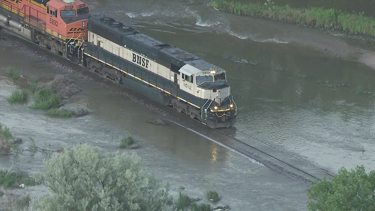 Watch train negotiate flooded track in NE Colorado