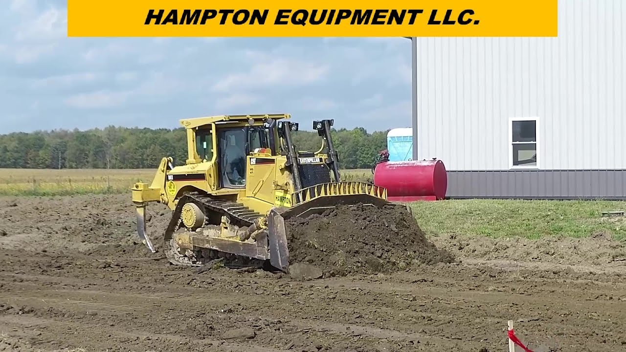 CATERPILLAR D8T DOZER PUSHING DIRT FOR POND