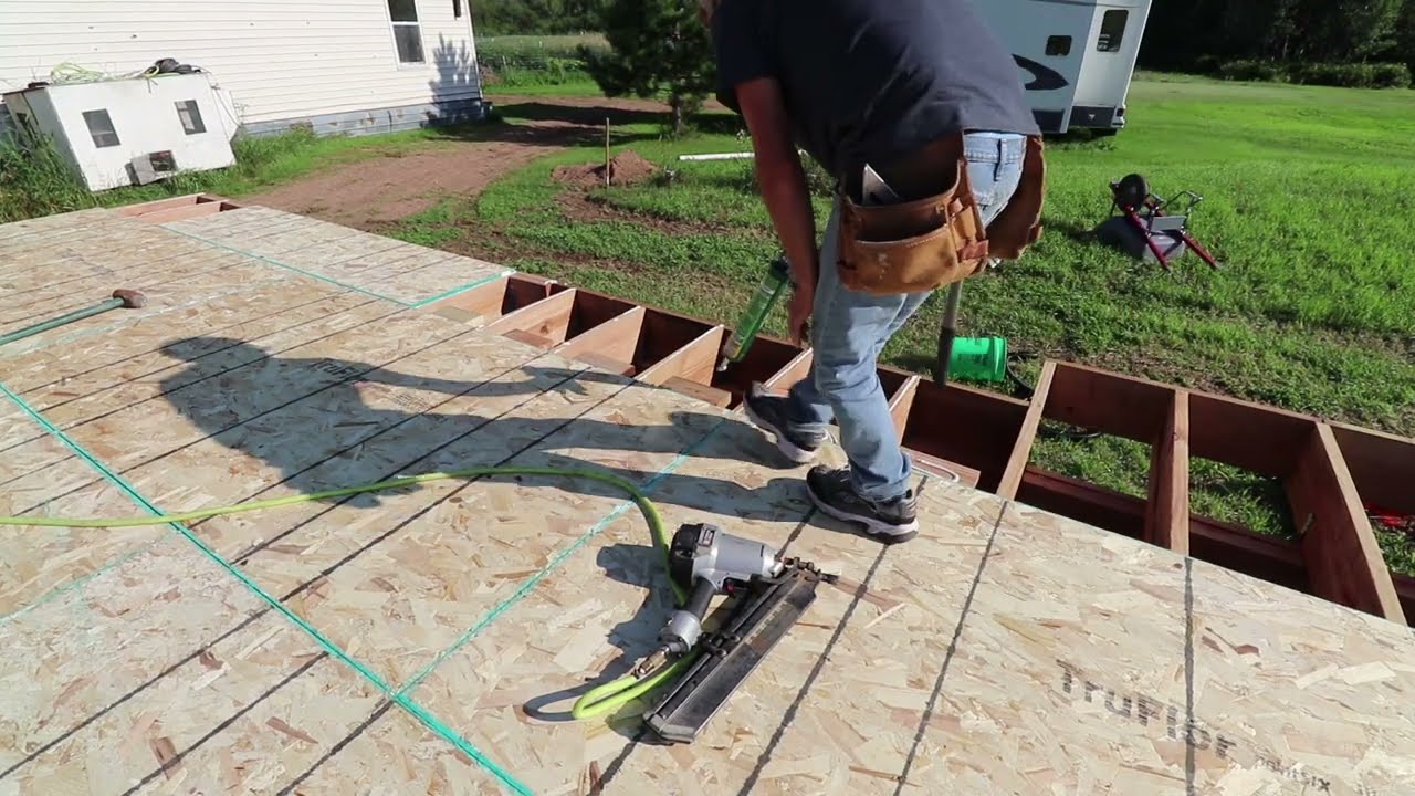 BUILDING THE GUEST HOUSE. Part 4. The deck gets plywood and the exterior walls get started.