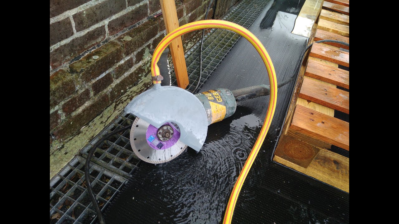 Cutting 30 mm ceramic tiles using modified angle grinder / nat zagen keramische tegel haakse slijper