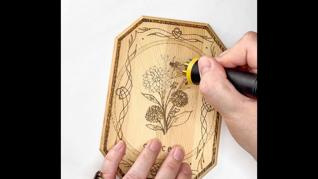 Wood-burning project: A dahlia motif on a small wooden plaque