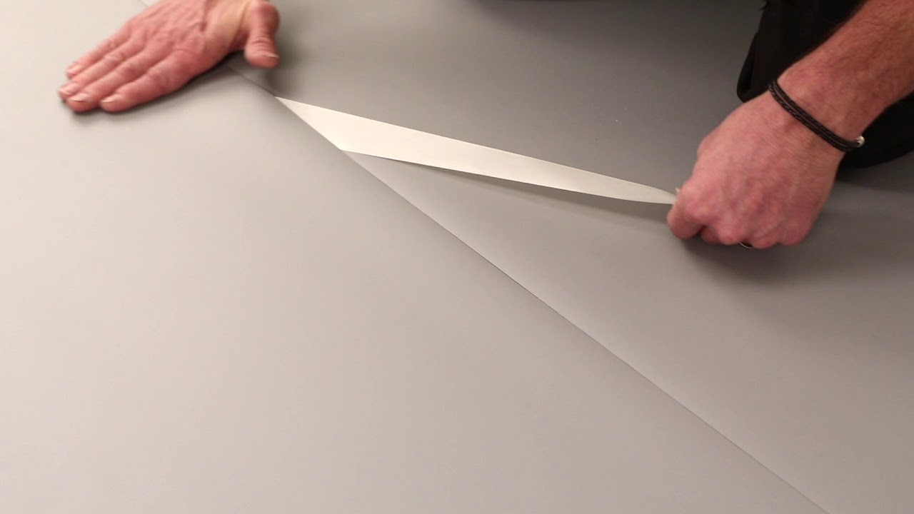 Installation of Harlequin Vinyl performance surface using double sided tape