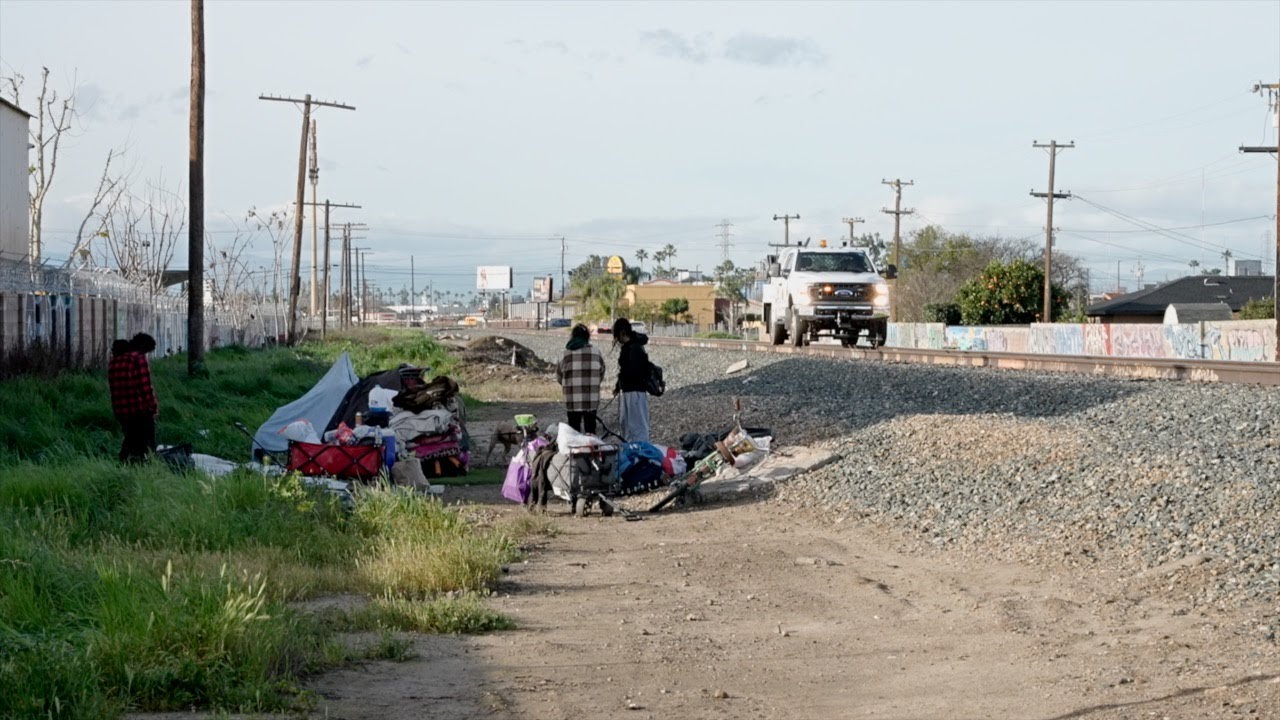 Police clear large railroad encampment, and offer resources to displaced residents