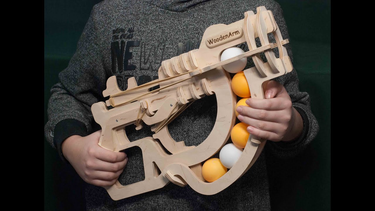 Ping pong gun with bottom magazine of balls