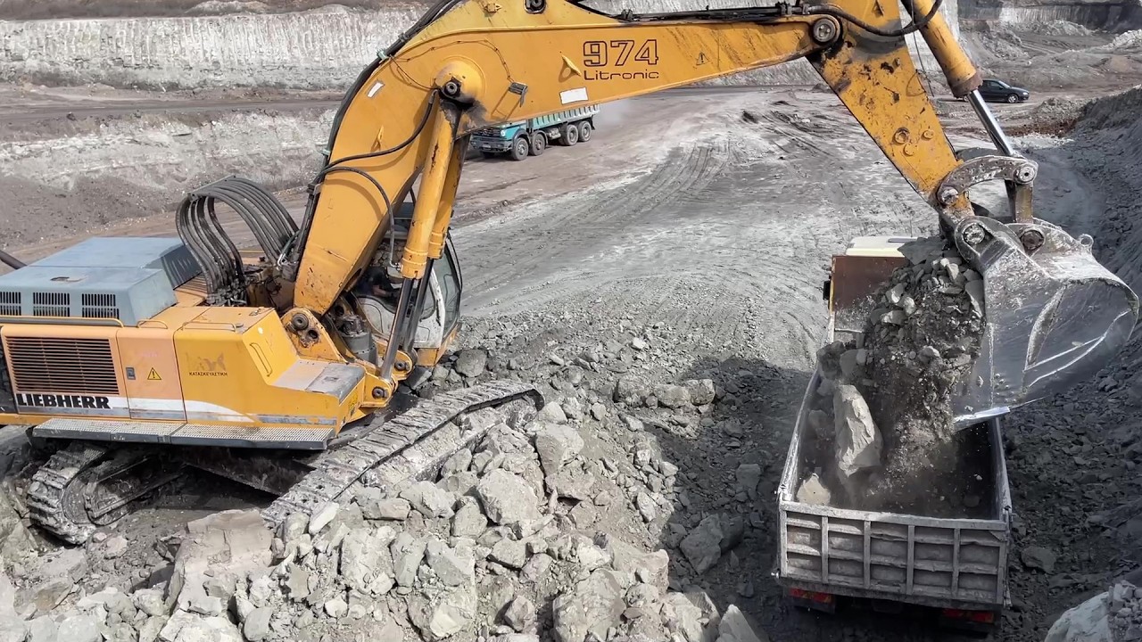 Liebherr 974 Excavator Loading Overburden On 4 Axle Trucks - Ascon Ltd