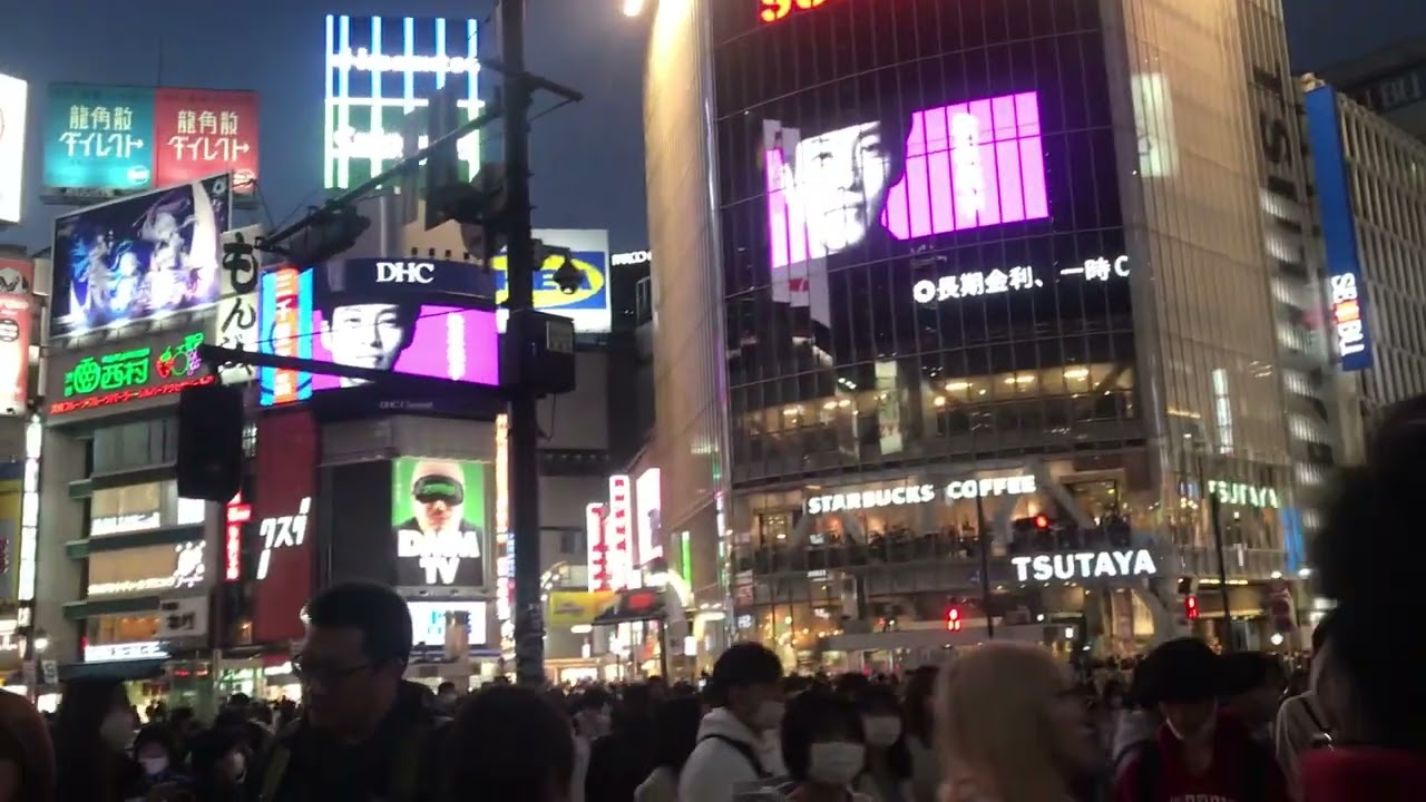 Shibuya Crossing Tokyo Rush Hour Cars Traffic in Japan with Busy Crowd of People