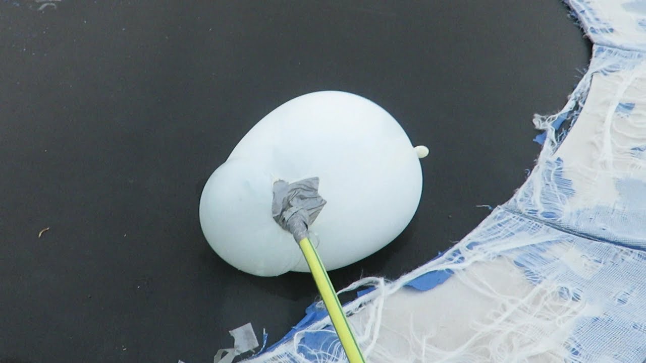 filling up a rubber glove with water