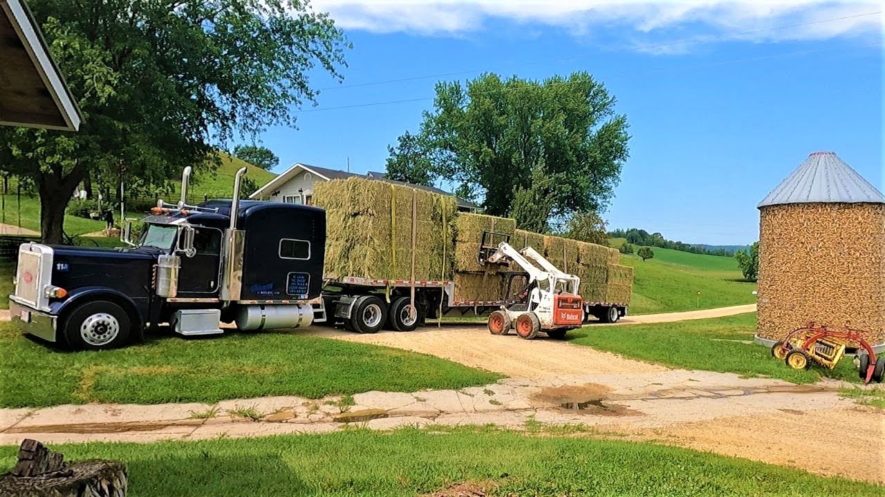 The Hay Has Arrived! Unloading Big Square Bales!