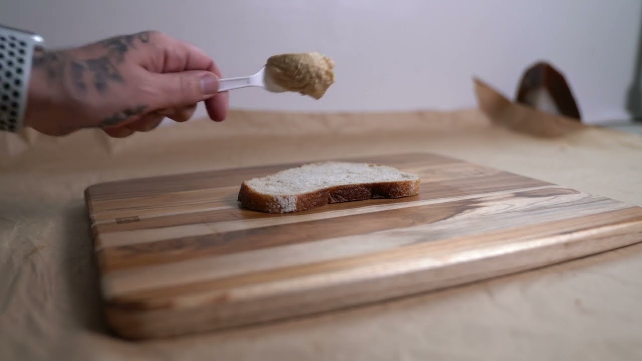 #veganrecipes Salted Tomato, Avocado, and Roasted Garlic Hummus on San Francisco Sourdough #vegan