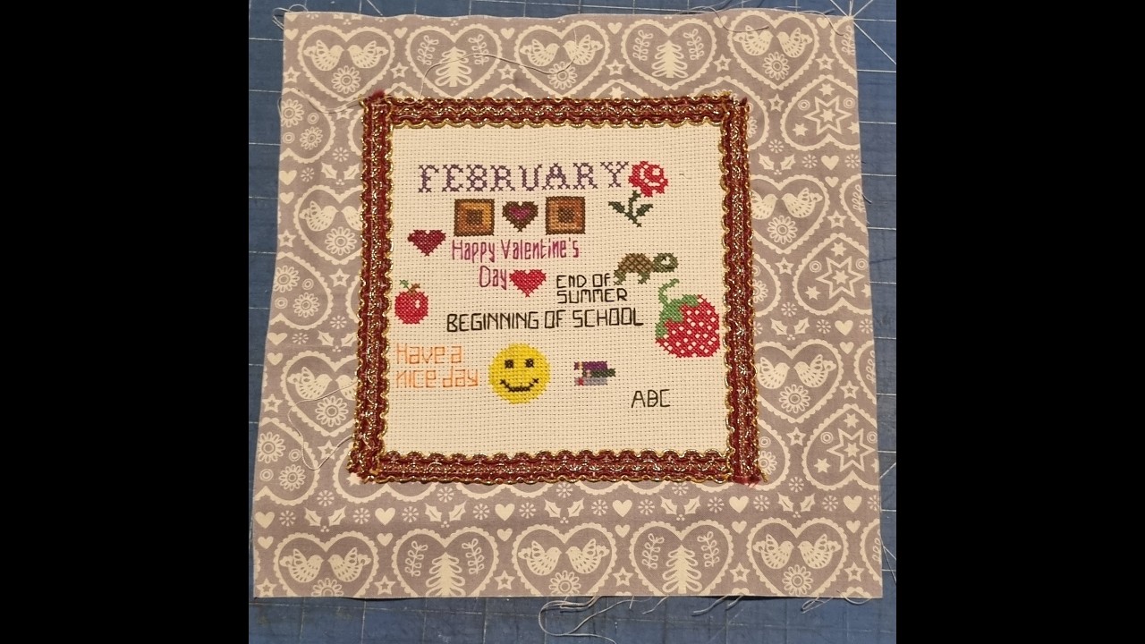 February cross stitch goes into a fabric square