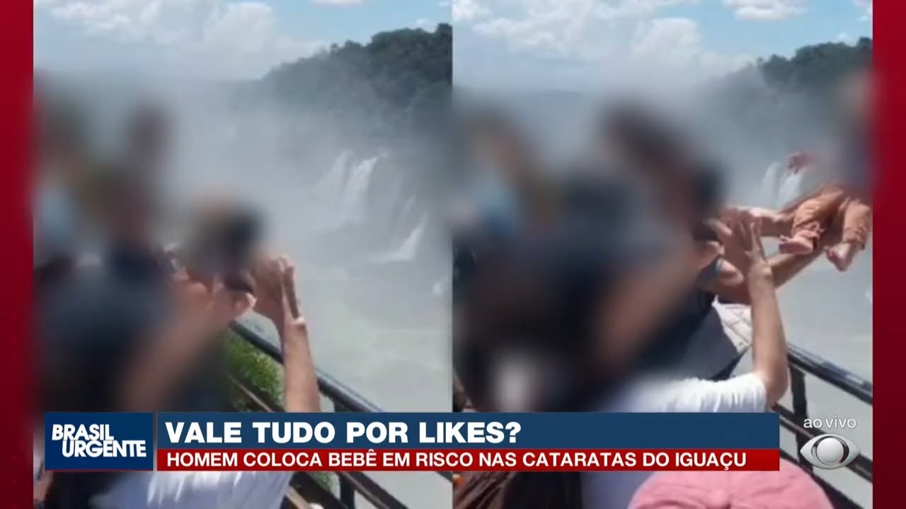Homem segura bebê para fora de grade nas Cataratas do Iguaçu