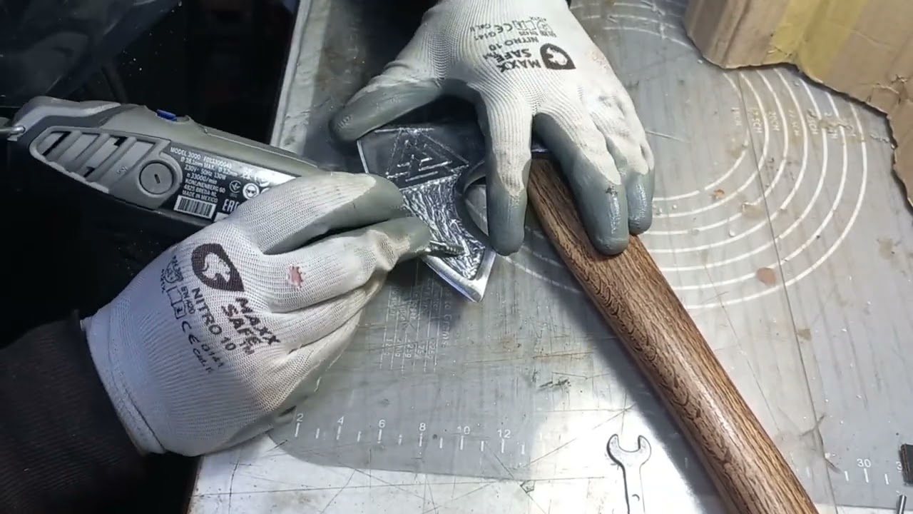 Part 1 of an celtic/viking valknut inspired axe engraving process